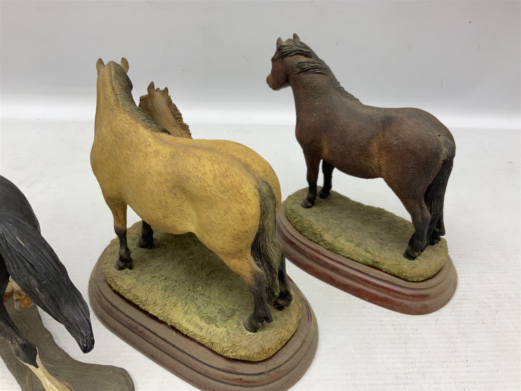 Collection of Border Fine Arts figures, comprising Exmoor Stallion A4058, Highland Mare & Stallion A2691, Welsh Cob A20804, On The Farm A0167, calf figure with bucket and figure group of cow and farmer with cat and kittens (6)