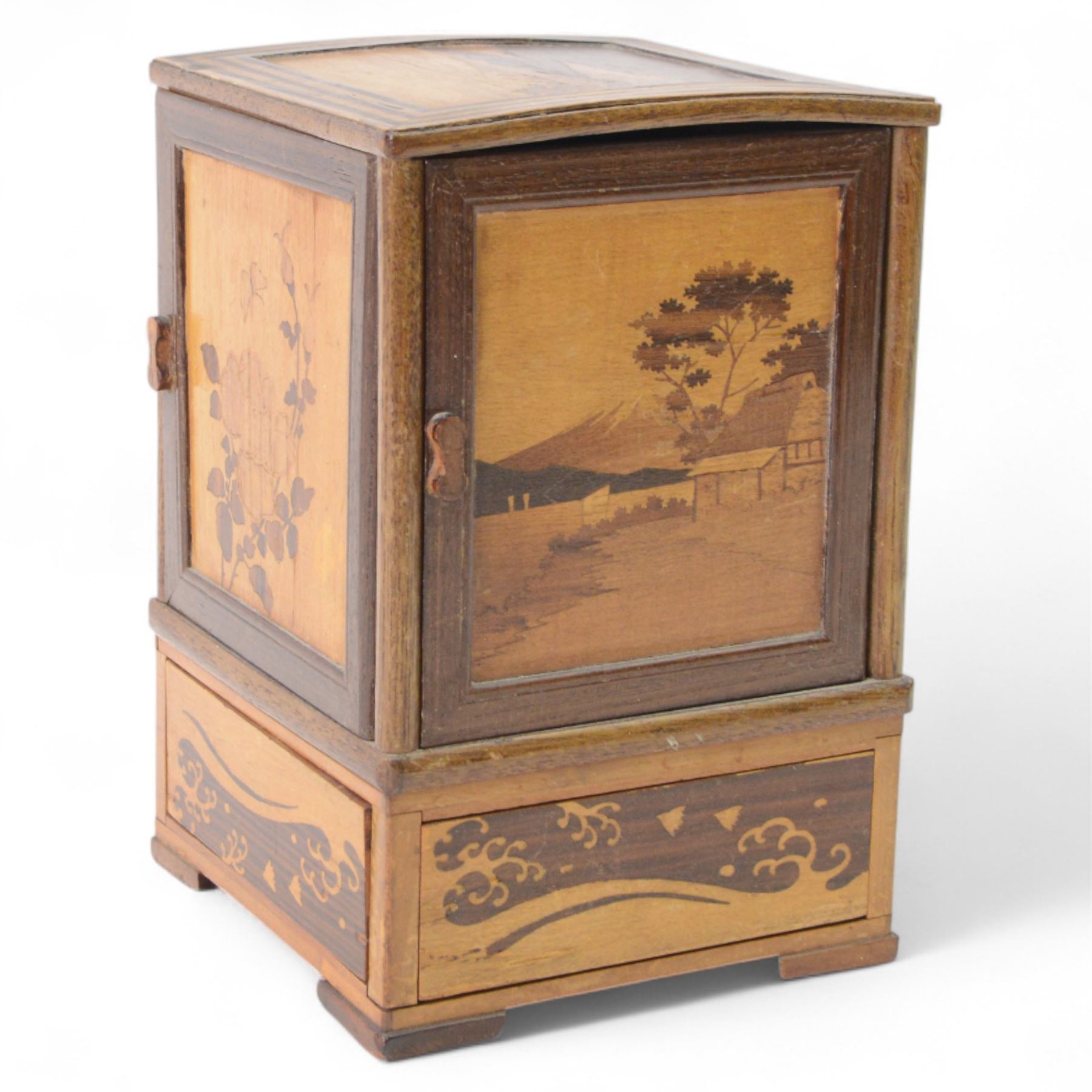 Desktop smokers cabinet, with an inlaid marquetry scene of Mount Fuji, the sides opening to reveal fitted pipe racks, H25cm