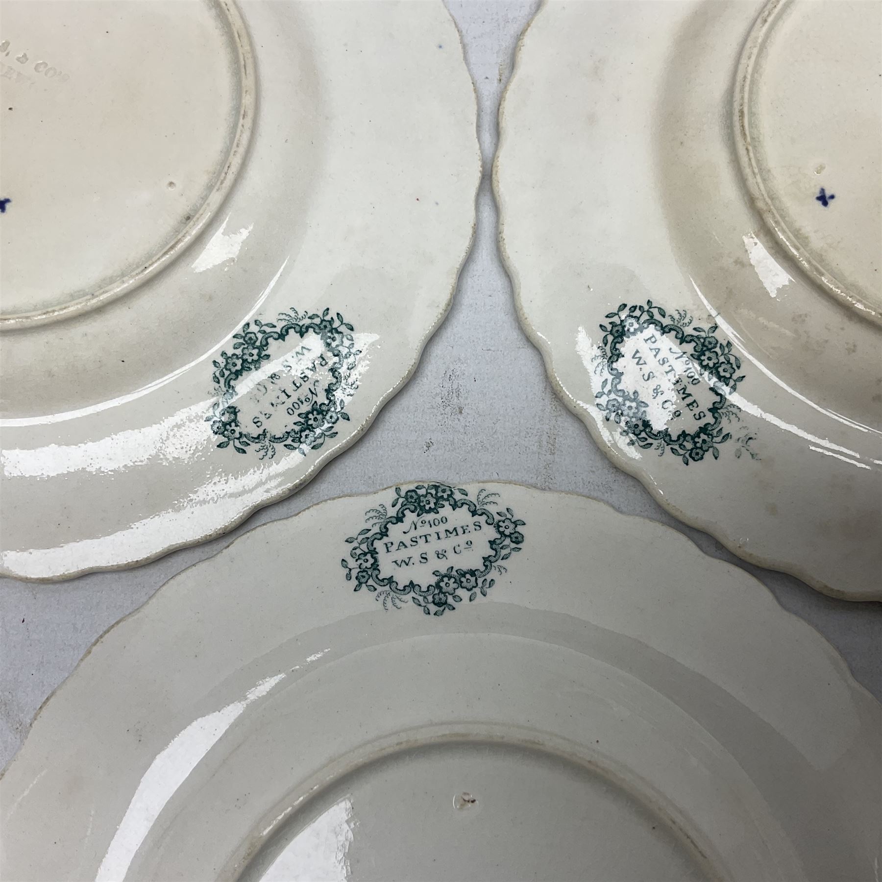 Collection of 19th century William Smith & Co nursery plates, to include examples decorated in the pastime series, and similar, all with moulded floral borders