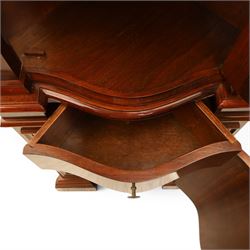 Victorian design mahogany corner cabinet, shaped carved cresting above bowed glazed upper door, with panelled side uprights, lower drawer over cupboard door decorated with floral marquetry, on plinth base