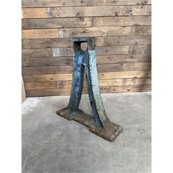 Pair of late 19th century heavy cast iron garden industrial trestles, painted in distressed blue paint