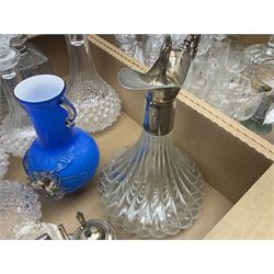 Assorted glassware, to include set of three decanters with labels in stand, metal mounted claret jug, drinking glasses, of various size and form, etc., in two boxes 