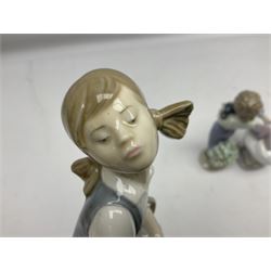 Six Lladro figures, comprising Naughty Dog no 4982, Best Friend 7620 and My Buddy no 7609, Kitty Confrontation no 1442, It Wasn't Me no 7672 and Rabbit Eating no 4772, three with original boxes, largest example H22cm