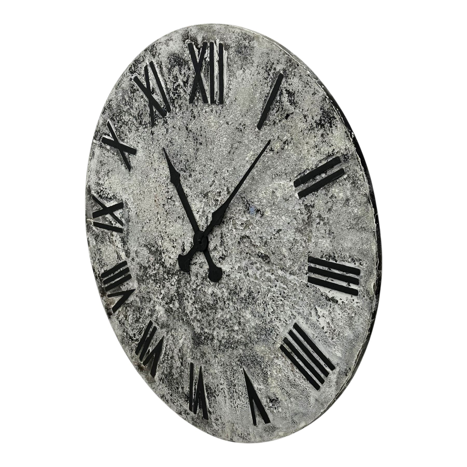 Substantial contemporary wall clock, mottled grey face with black Roman numerals and black spade hands, backed by a grey-painted metal panel