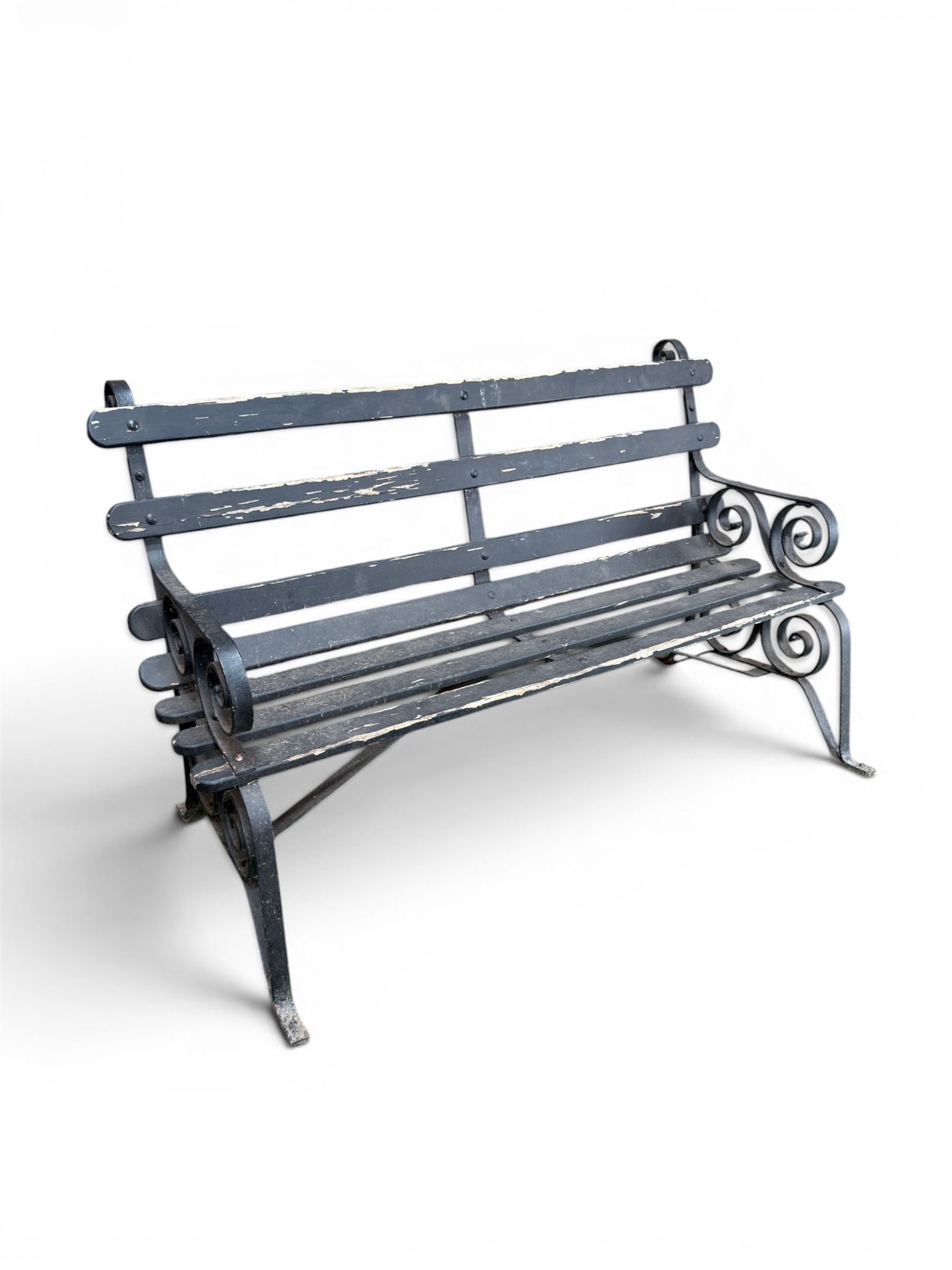 Coalbrookdale - rare pair of wrought iron and slatted wood garden benches, the twin wrought iron strapwork bench-ends formed of four scrolls over splayed feet, number 77 in the Coalbrookdale Castings Catalogue (see illustration)