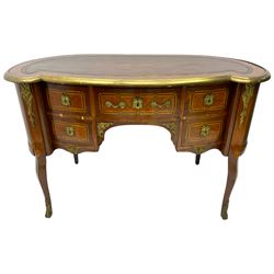 19th century French Kingwood kidney shaped kneehole desk, inset leather writing surface with a moulded brass edge, fitted with single frieze drawer flanked by two short drawers, the facias inlad with chequered satinwood banding, canted uprights with foliate cast gilt metal mounts, raised on cabriole supports