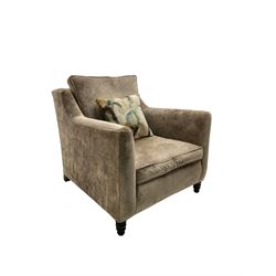 Duresta - 'Horatio' armchair, upholstered in champagne fabric, raised on turned supports