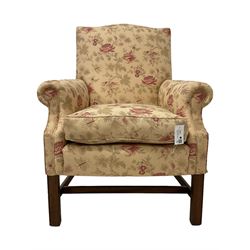Peter Dudgeon - Georgian design mahogany framed armchair, shaped cresting rail over sprung back and seat flanked by rolled arms, upholstered in floral patterned fabric with matching seat cushion, on square supports joined by stretchers
Provenance: From the Estate of the late Dowager Lady St Oswald