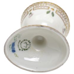 Royal Copenhagen Flora Danica wares, comprising covered mustard pot with naturalistically modelled vine handles and decorated with Cushion Pink (Cucubalius Acaulis) H8cm, milk jug decorated with Maiden Pink (Dianthus Deltoides) H7cm, covered dish decorated with Dwarf Milkwort (Polygala Amarum) W8cm, oval salt cellar decorated with Alpine Squill (Scilla Bifolia) W11cm, egg cup, pin dish and cased hand mirror, various Latin specimen inscriptions to base, all with printed and painted marks beneath (7)