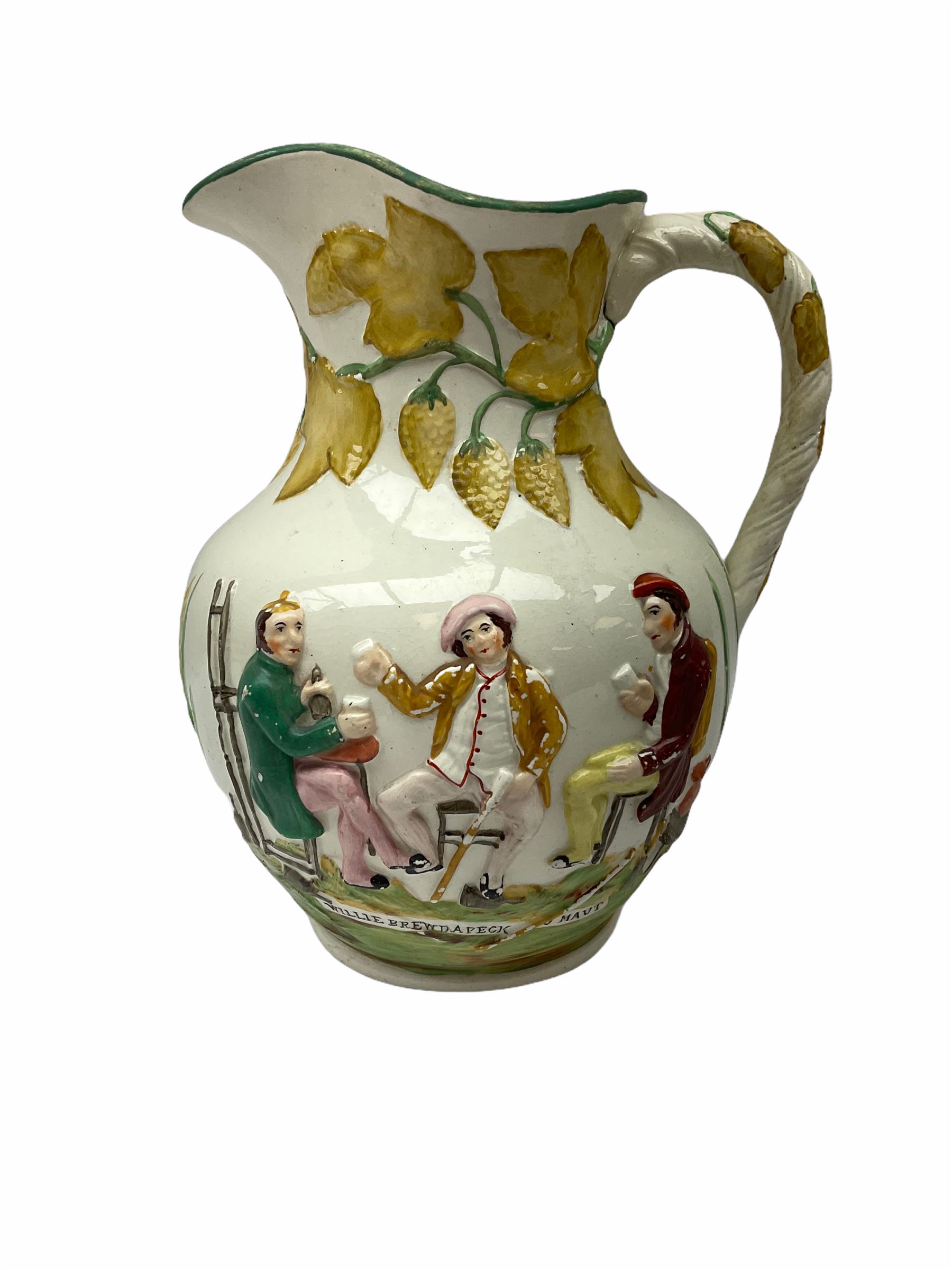 19th century Staffordshire pottery jug, entitled Willie Brewd a Peck o maut, depicting figures in relief, H24cm, a blue and white Victoria Ware Ironstone shaving bowl, L27.5cm, and a 19th century French Sarranguimes tankard with black transfer printed band depicting figures and horses, H17cm
