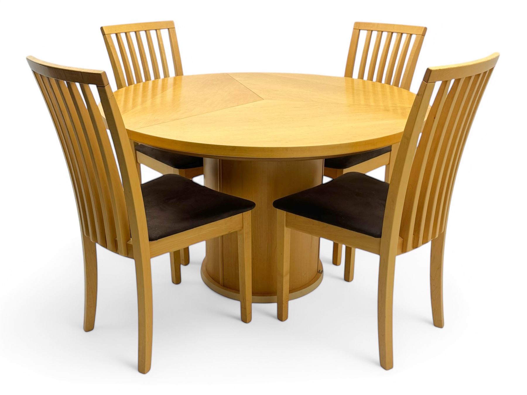 Skovby - 'SM32' late 20th century beech circular extending dining table circular segmented top turning to activate a patented spring loaded triple leaf extension stored within the cylindrical column base (Extended diameter 146cm); and set of four chairs (Width 47cm, Depth 56cm, Height 95cm, Seat height 47cm)