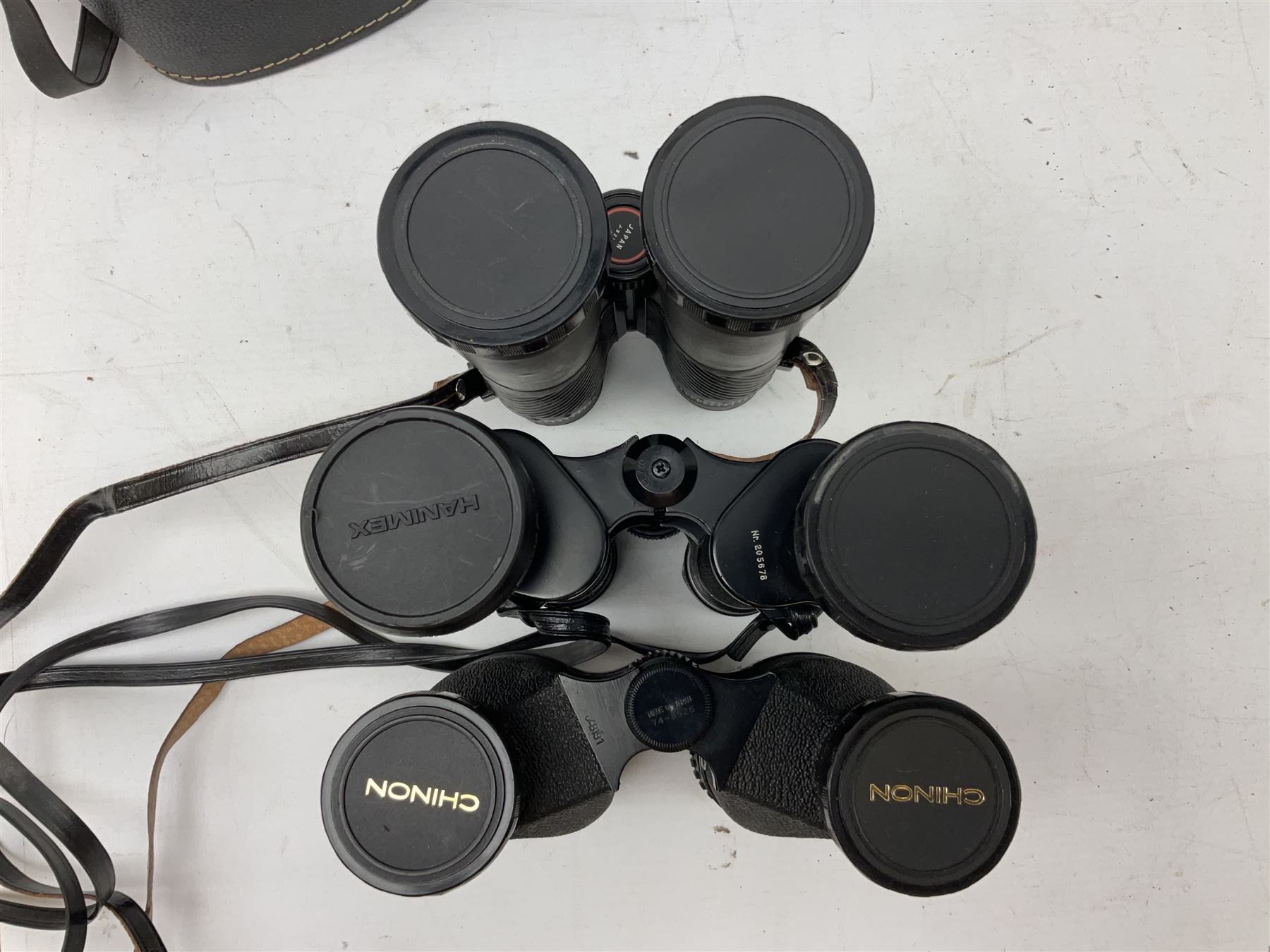 Eleven cased pairs of binoculars to include Summit 8x30,  Concord 8x40, Tasco no. 106 8x - 16x40, Chinon 10x50, Tokina 7x42 Field, Zoom 6x- 12x32 etc