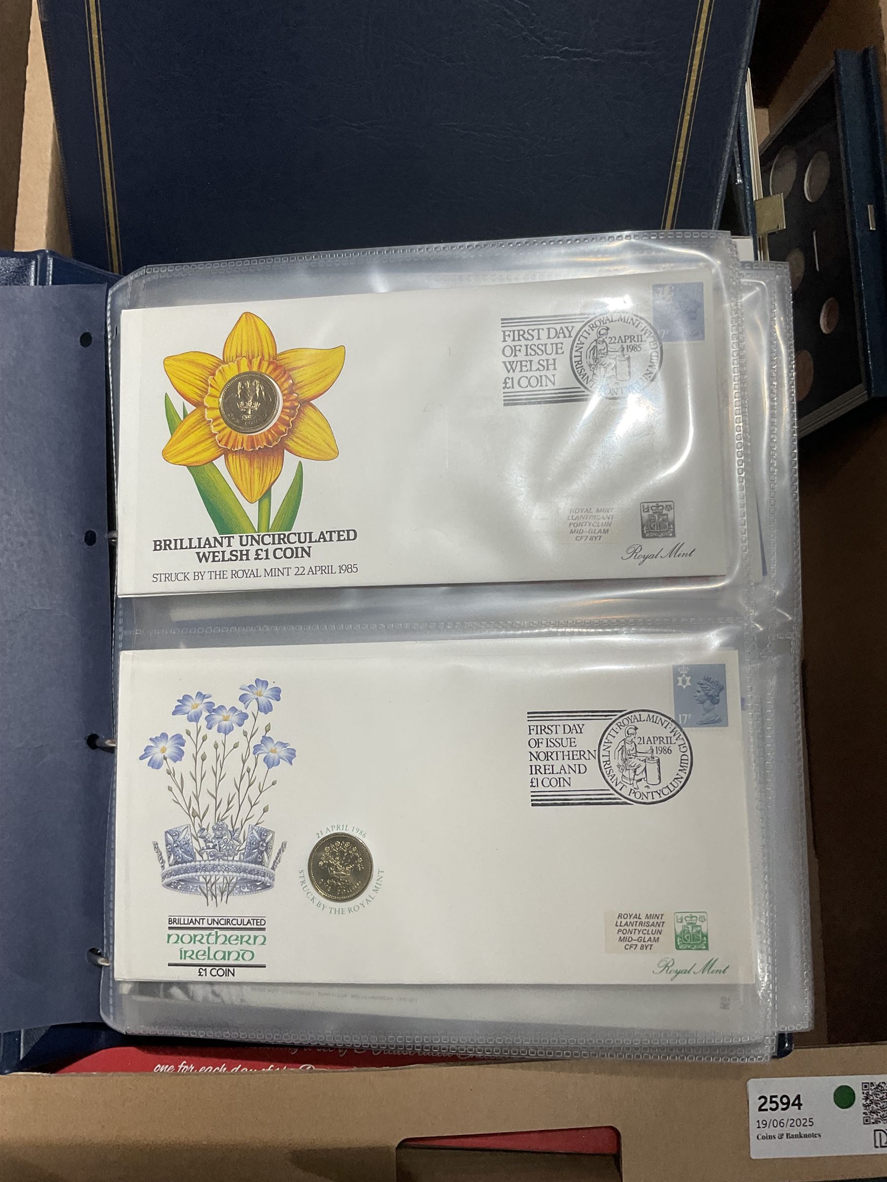 Approximately one hundred and fifteen Royal Mint coin covers, in two ring binder folders and loose, together with approximately 53 grams of Great British pre-1920 and approximately 68 grams of Great British pre-1947 silver threepence coins, and a small quantity of further pre-decimal coins