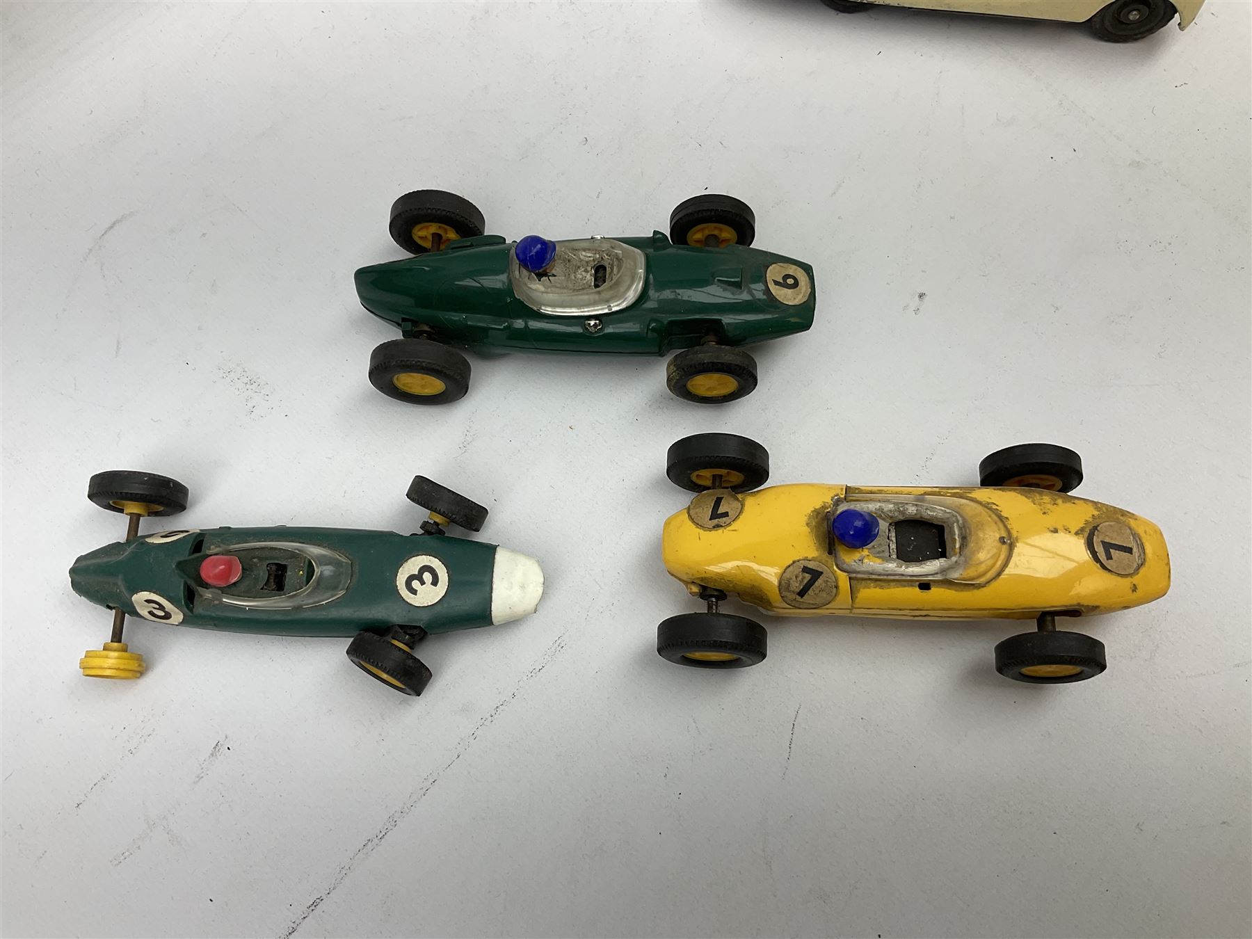 German Schuco Examico 4001 tin-plate clockwork model car with cream body work, steering wheel and gear stick; repainted Schuco die-cast BMW; three Minic Motorways cars; and three Scalextric Formula 1 racing cars; all unboxed (8)