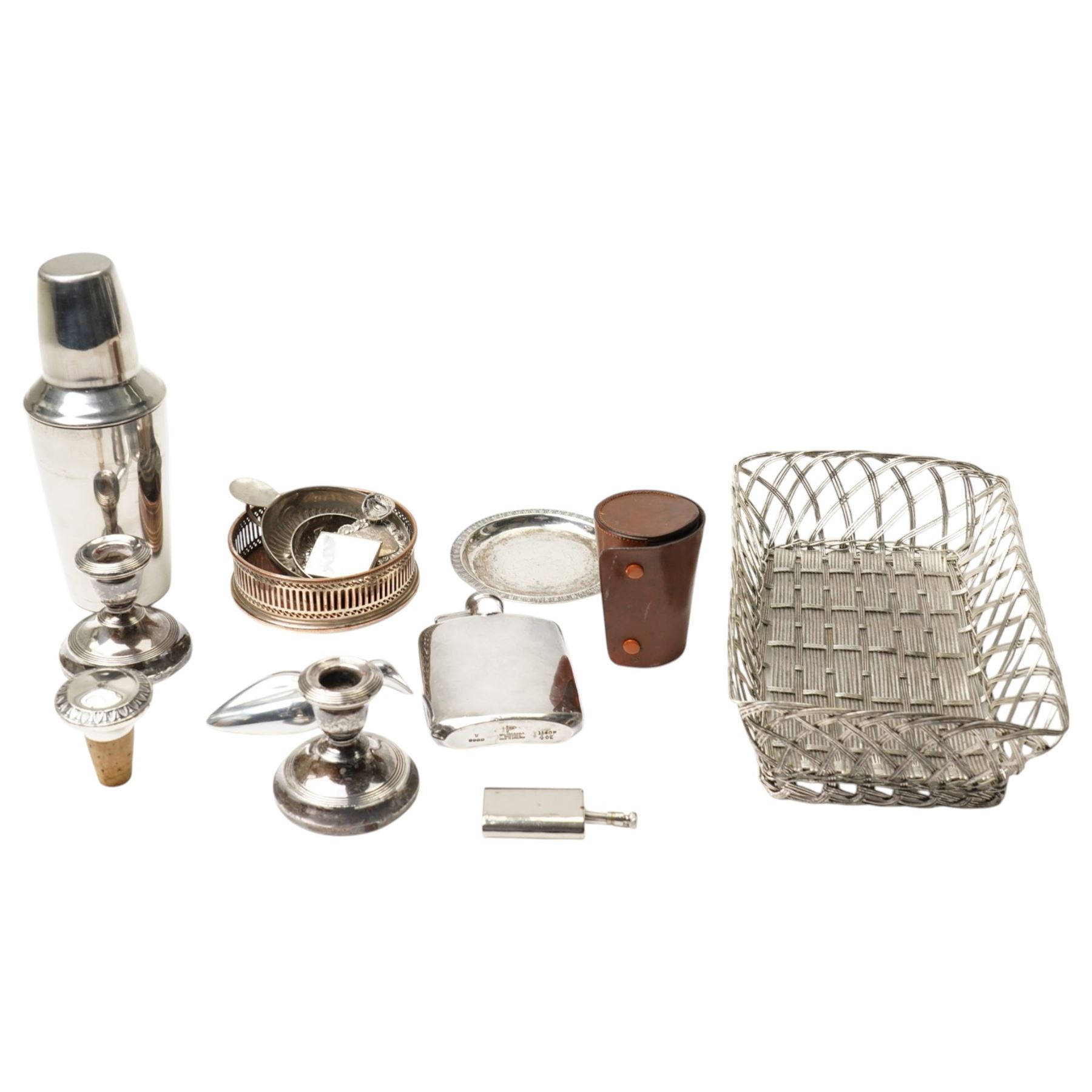 Pair of silver dressing table candlesticks, miniature folding photograph frame, silver port label, plated cocktail shaker and other silver plated items