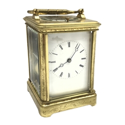 Early 20th century brass five glass carriage clock with button repeater, the brass case engraved with trailing foliage decoration, white enamel Roman dial, eight day movement striking the hours on bell, inscribed 'J. T. Ellsworth from... J. Blundel, Crosby Hall', with key, H14cm