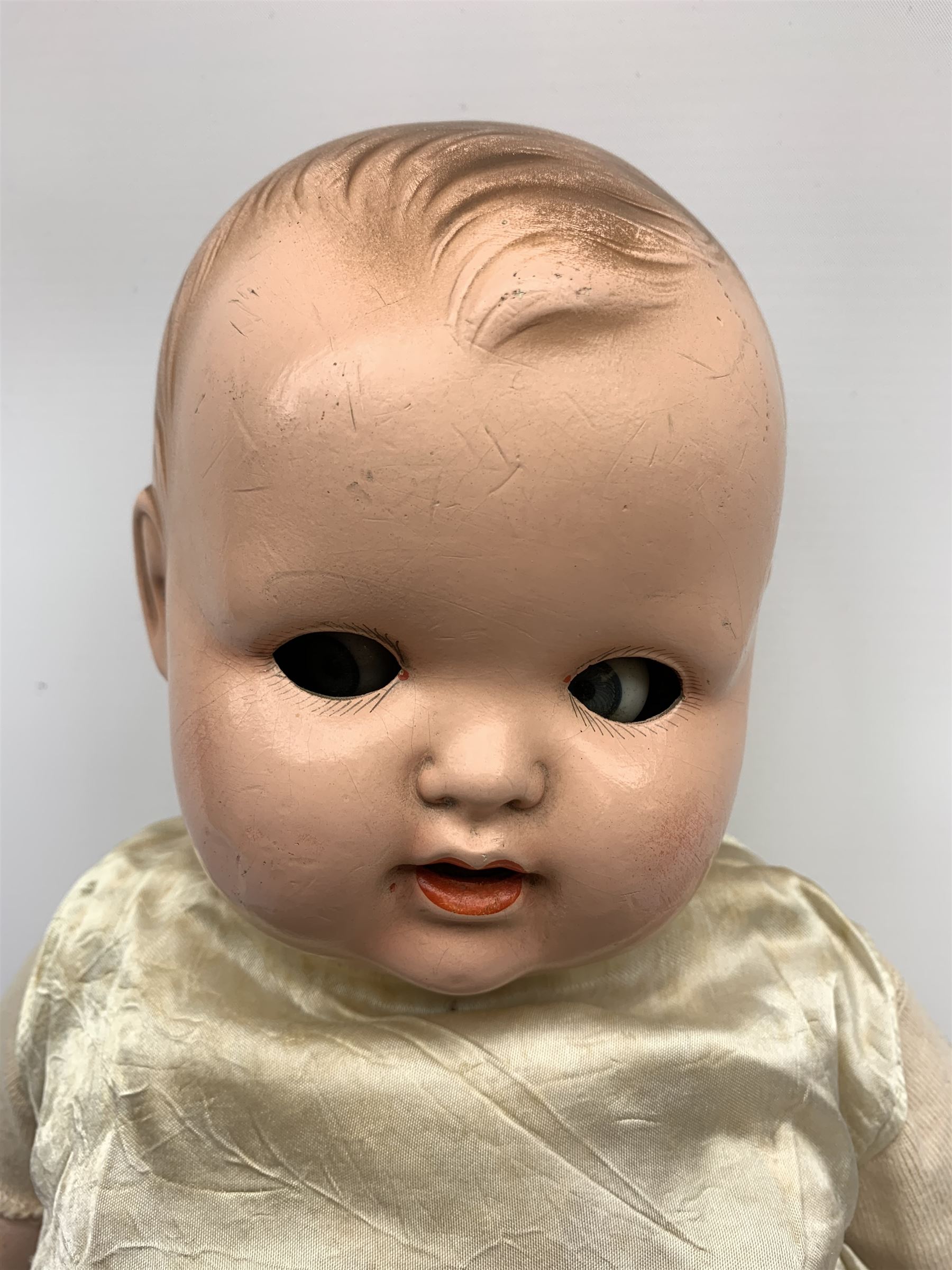 Seyfarth & Reinhardt composition head baby doll with moulded hair, sleeping flirty eyes, open mouth with one tooth and tongue and soft body with composition jointed limbs, marked 'SuR Germany 30/5' H47cm; together with a Golborne Dolls 'Golborne Beauty' composition head and body bride doll, marked 'F.P.23' in original box H63cm (2)