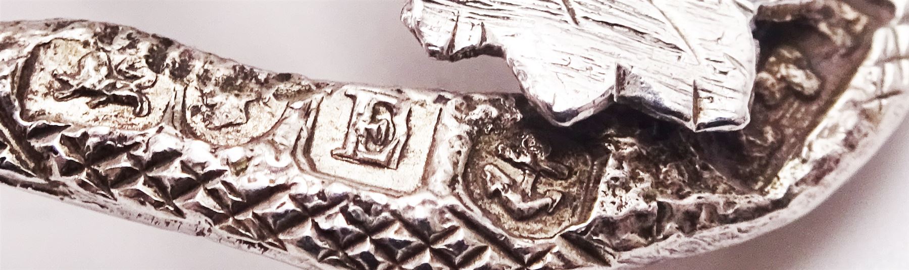 Unusual Victorian silver caddy spoon, the oval parcel gilt bowl embossed with leaf, leading to a flower head mounted tendril handle also detailed with leaf, hallmarked Hilliard & Thomason, Birmingham 1853, L8.5cm, approximate weight 0.49ozt (15.3 grams)