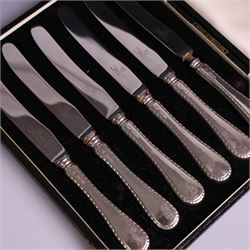 Pair of silver cruets, of baluster form and upon four pad feet, hallmarked Laurence R Watson & Co, Birmingham 1993, together with a set of six silver handled tea knives, hallmarked Barker Brothers Silver Ltd, Sheffield 1955, both in fitted cases