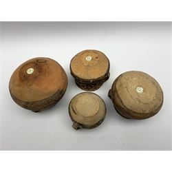 Four Chinese Neolithic pottery vessels, each with twin loop handles to the shoulder and painted geometric banded decoration to the body, three bearing labels for Eskenazi London, tallest H13cm