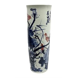 Chinese floor vase of cylindrical form decorated in blue, white and red wih birds perched upon blossoming branches, with flared rim, H62cm