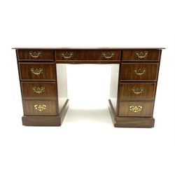 Mahogany twin pedestal desk, moulded rectangular top with inset leather, fitted with seven drawers, plinth base