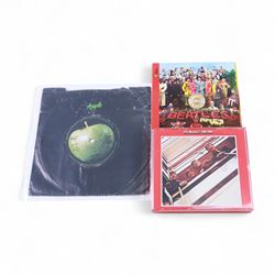 The Beatles memorabilia, including 1964 Fan Club patch, framed with a black and white picture of the band, a further framed black and white picture displayed with Strawberry Fields Forever single, The Beatles Anthology, biographies and other books, two CDs, mug, etc