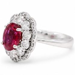 18ct white gold unheated oval ruby and round brilliant cut diamond cluster ring, hallmarked, ruby 3.07 carat, total diamond weight approx 1.65 carat, with WGI certificate