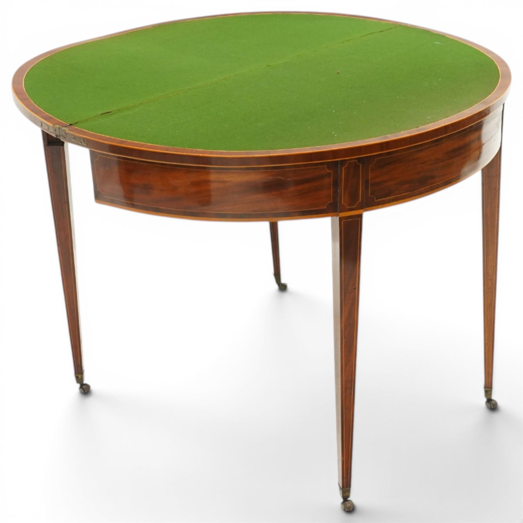 George III inlaid mahogany demi-lune card table, the hinged lunette top inlaid with satinwood stringing and crossbanding, opening to reveal a baize line interior, banded frieze over single gate-leg action and square tapering supports with castors
Provenance: Kirkham Hall