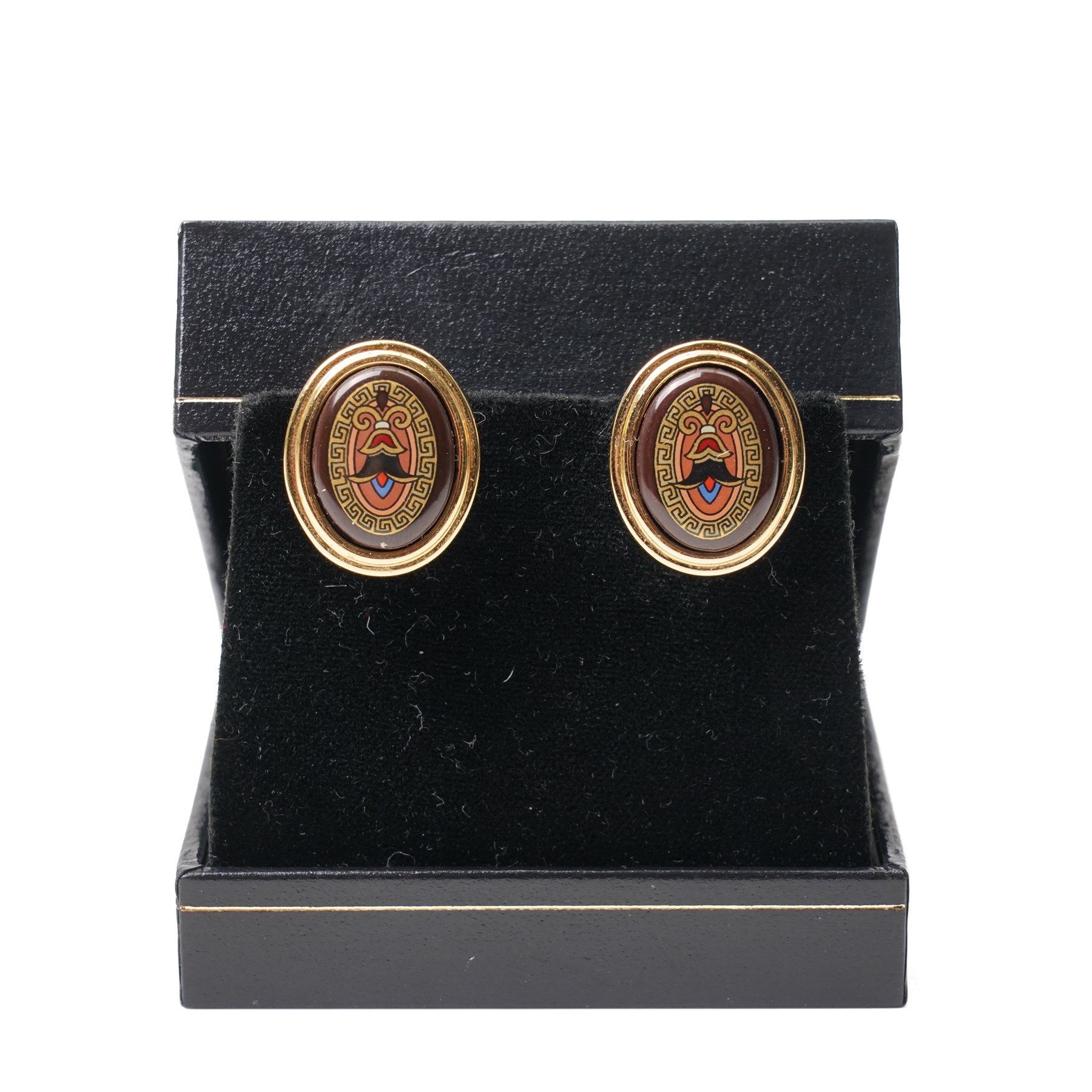 Michaela Frey gold plated and enamel suite of jewellery from the Greco-Roman collection, including a pair of oval stud earrings, hinged bangle and pendant on multistrand rope necklace, all boxed