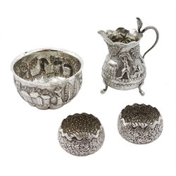 Middle Eastern silver cream jug and sugar bowl, embossed farming decoration, the jug with a cobra handle and two similar silver salts, approx 7oz (4)