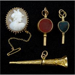 Gold cameo brooch depicting a Roman centurion, 9ct gold circular bloodstone and carnelian watch key, Birmingham 1897 and two other stone set watch keys