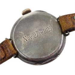 WWI silver trench wristwatch, white enamel dial with Arabic numerals, red 12 and subsidiary seconds dial, the back case engraved Nov 27th 1915, case by Stockwell & Co, London import mark 1914, on brown leather strap