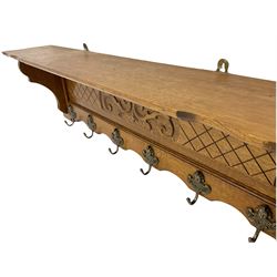 French style oak coat rack, carved with scrolled foliage and fitted with hooks