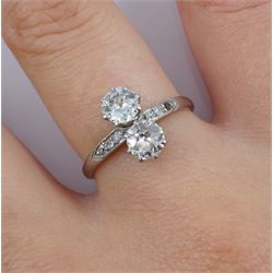 Platinum two stone diamond ring, with diamond set shoulders, two principle diamonds approx 0.45 carat each