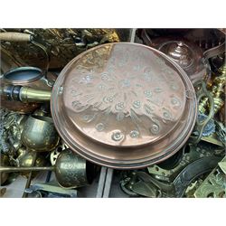 Quantity of copper pans and teapots, dish and sieve with pierced heart decoration and brass handle, together with quantity of brassware to include brass Art Nouveau crumb tray and brush, repousse chargers, fire tool accessories, decorative canon, sword and guns etc