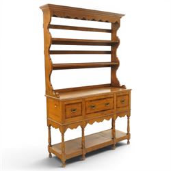 Georgian design elm dresser with plate rack, the two-tier rack with shaped frieze and hook...