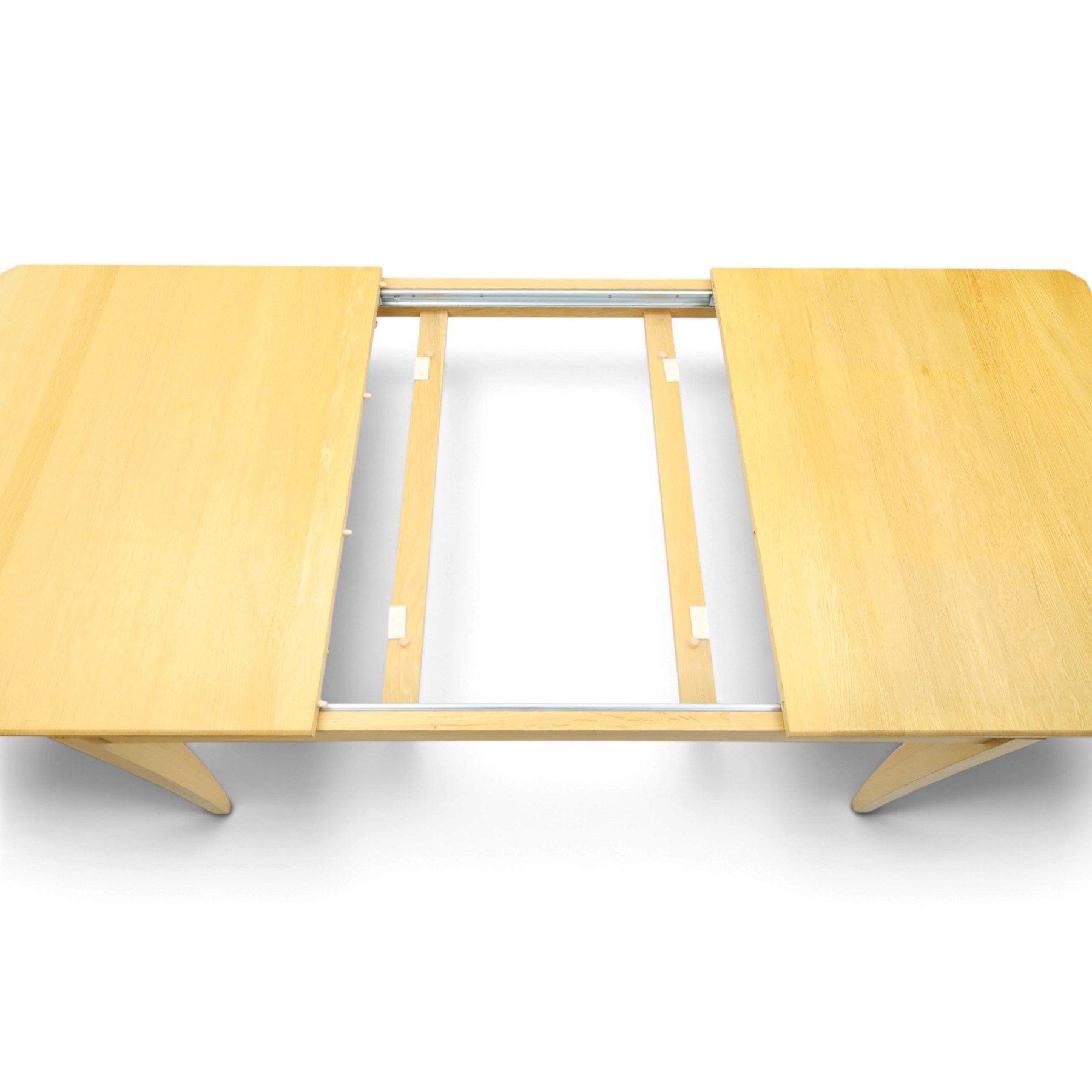 Ercol - 'Artisan' light oak extending dining table, rectangular top with canted corners, with stowable leaf extending the table to 193cm, shaped faceted supports