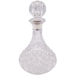 Modern silver mounted cut glass ships decanter, the silver collar hallmarked Charles S Green & Co Ltd, Birmingham 1976, H26.5cm, together with a modern silver mounted glass vase, of slightly tapering cylindrical form etched with ferns and fronds, the silver collar hallmarked London 2001, makers mark W W, H19cm, (2)