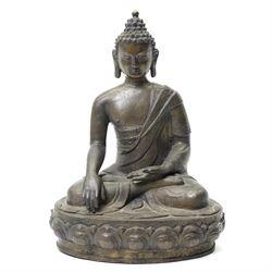 Tibetan bronze Buddha posed seated on a lotus base H30cm