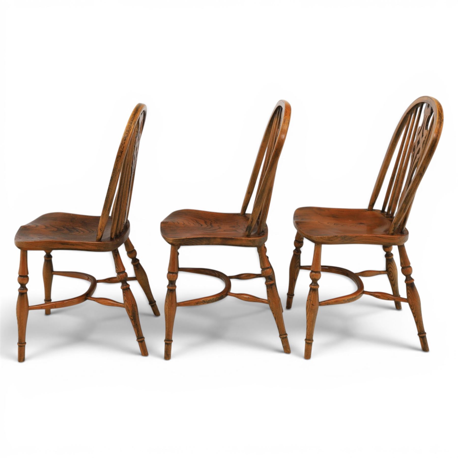 Set of six elm Windsor chairs, saddle seats with crinoline stretchers