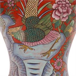 Table lamp of baluster form, decorated with ducks and lilies upon a red ground upon a circular wooden base, H64cm