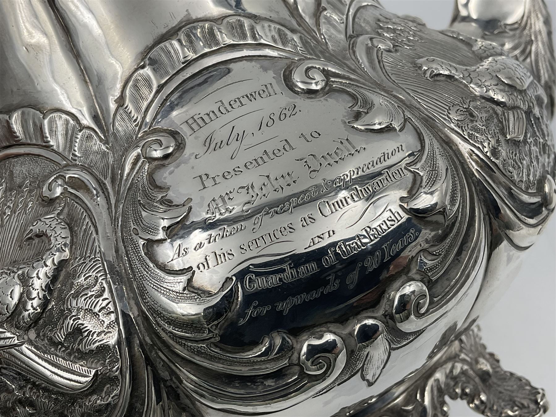 Victorian silver three piece tea service, comprising teapot, twin handled open sucrier, and milk jug, each of bellied form with acanthus capped scroll handles, the sides embossed with alternating scroll edged vacant panels and panels containing a pair of birds, upon four palmette feet, the teapot with ivory insulators to handle, and bird finial to the hinged domed cover, hallmarked William Hunter & Son, London 1861, teapot H19cm, including handles sucrier H13.5cm, including handle milk jug H12cm

This item has been registered for sale under Section 10 of the APHA Ivory Act