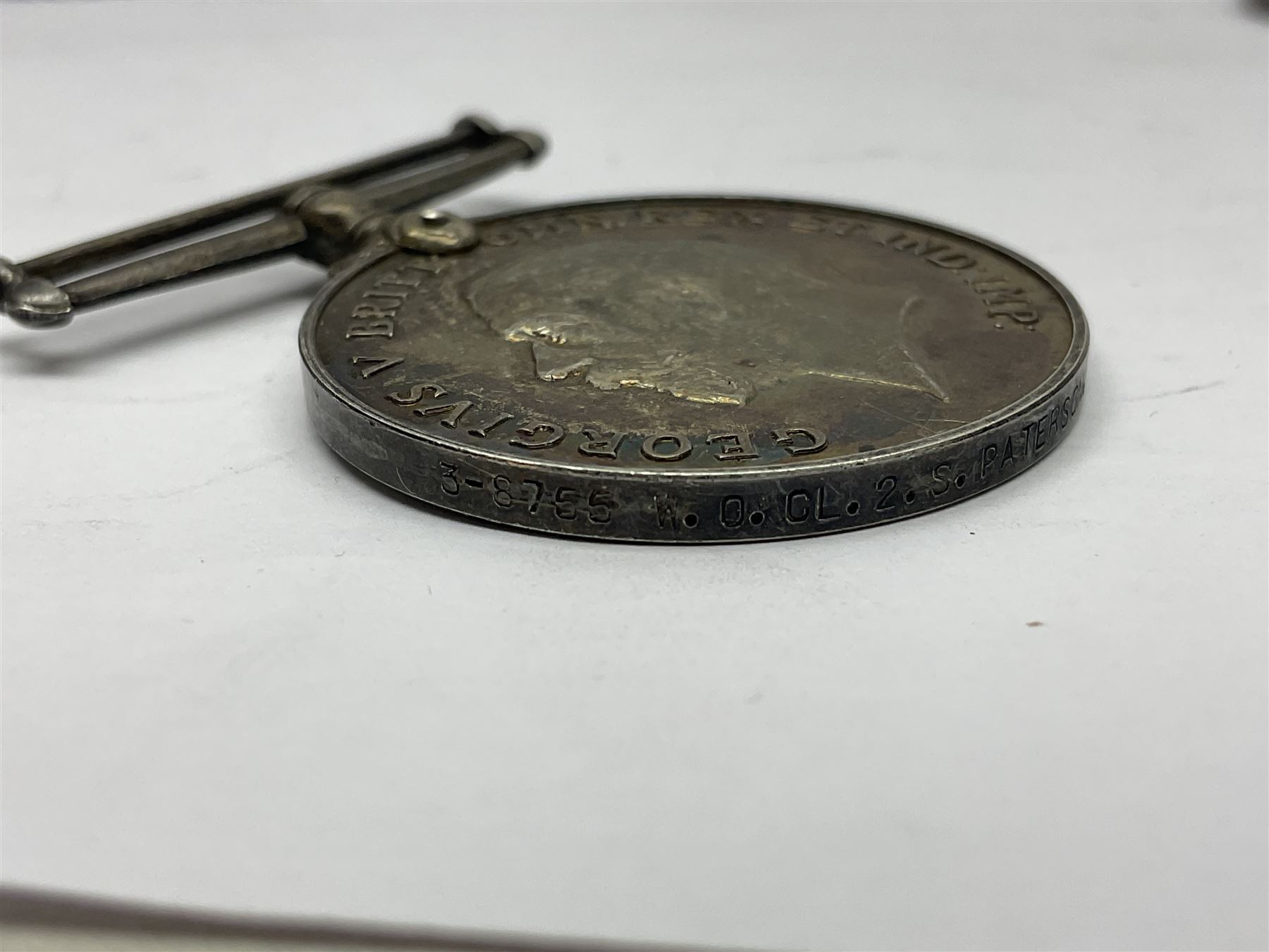 WW1 group of three medals comprising 1914-15 Star awarded to L-Cpl. W.J. Horspool R.War.R., British War Medal and Victory Medal awarded to A. Cpl. W.J. Horspool R.War.R.; WW1 British War Medal awarded to 3-8755 W.O.Cl.2. S. Paterson North'd Fus.; and hallmarked silver and enamel Northumberland Football Association Junior Cup Runners Up fob 1921-22 on silver chain (5)