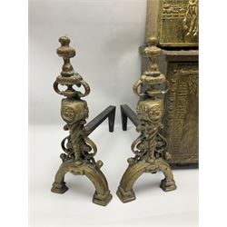Pair of brass and iron fire dogs, together with brass coal box embossed to the lid with figures and a brass magazine rack, coal box H32cm