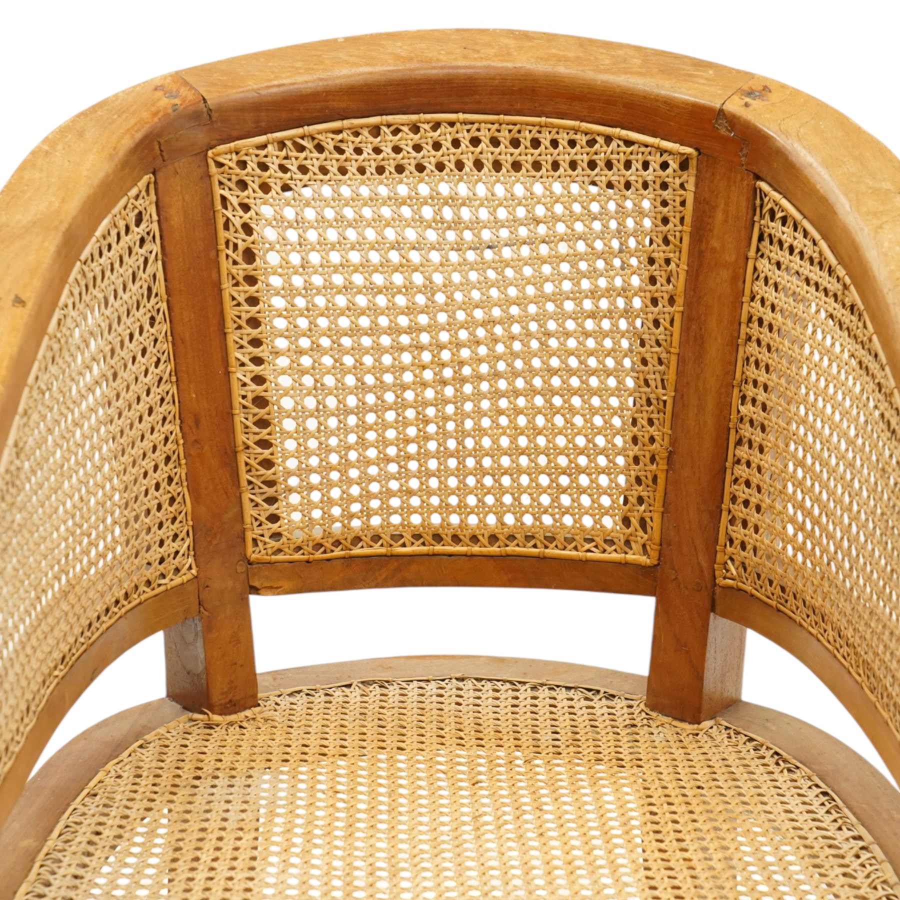 Late 20th century Anglo-Indian teak framed bergère armchair with canework back and seat, raised on tapering supports
Provenance: purchased Liberty & Co in the 1990s from the oriental line
