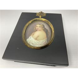 Continental School (19th century)
Portrait miniature upon enamel
Head and shoulder portrait of a young woman draped in a white robe, in the style of KPM and Vienna
Within a gilt metal mount and rectangular ebonised frame with acorn and oak leaf mounted suspension ring
Oval 6cm x 4.5cm
Frame 11cm x 9cm