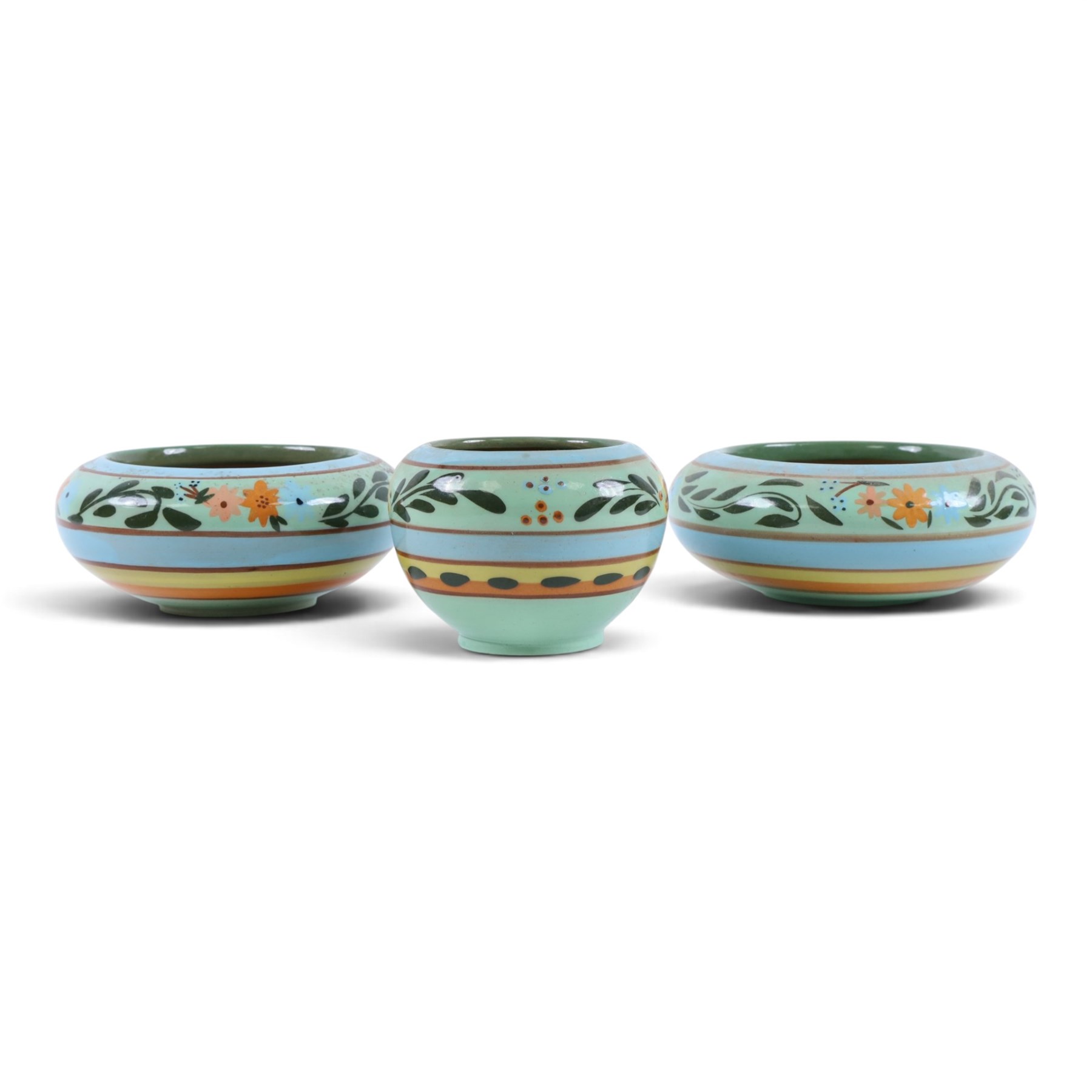 Hartrox Stoneware comprising three jugs, two vases and three bowls, all with green, blue and yellow floral decoration, with printed marks beneath, tallest H20cm