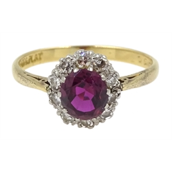 Gold oval ruby and diamond cluster ring, stamped 18ct & Plat