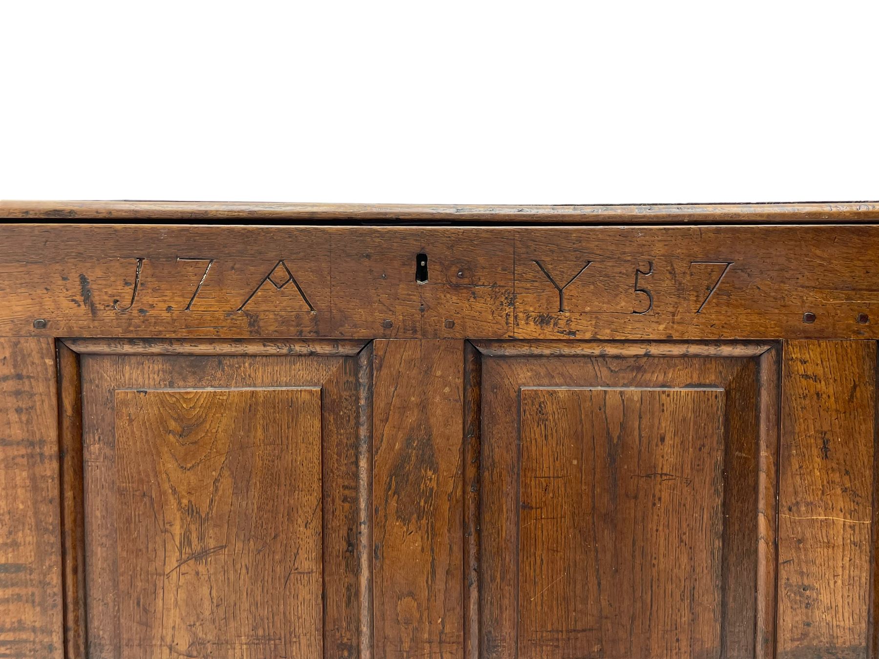 Georgian oak mule chest, moulded rectangular hinged lid over quadruple fielded panel front, the frieze inscribed '17 A Y 57', fitted with two drawers, panelled ends and back, on stile supports